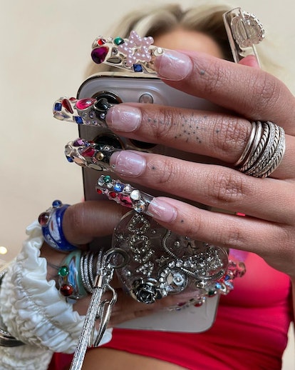 The gemstones & pearls on Doja Cat's 3D nail design. The details pop against the clear acrylic Frenc...