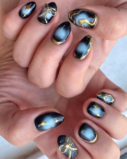 Gold galaxy nails.
