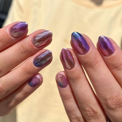 Purple chrome galaxy nails.