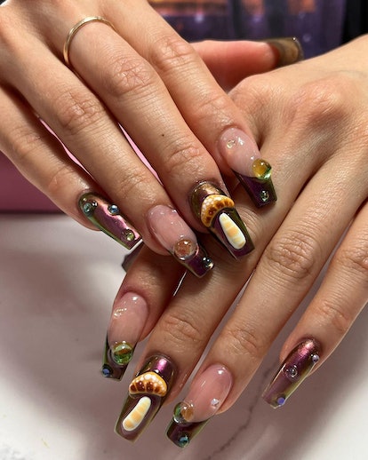 A trippy mushroom nail art design that matches the cabincore aesthetic.