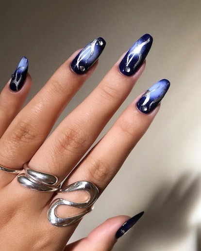 Blue and black galaxy nails.