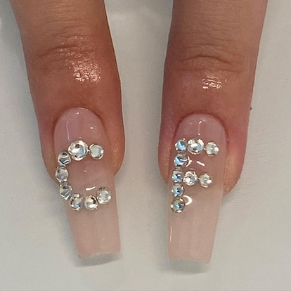 Bedazzled nail initials that match the 3D chrome nail art trend.