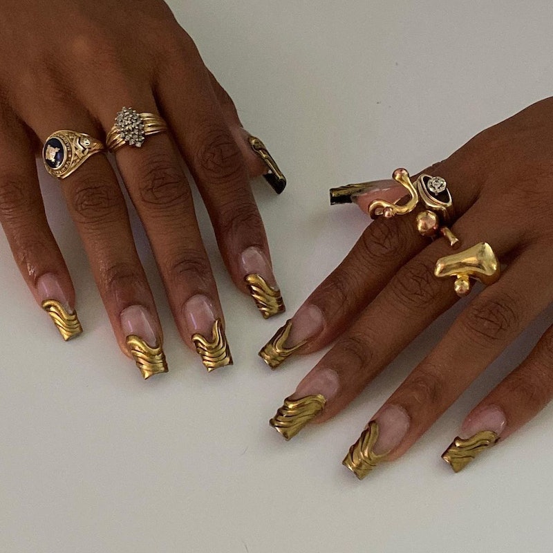 Here's inspo for 3D chrome nails, a major nail art trend for winter 2023.