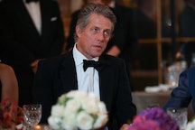 British actor Hugh Grant looks on during a state banquet at the Palace of Versailles, west of Paris,...