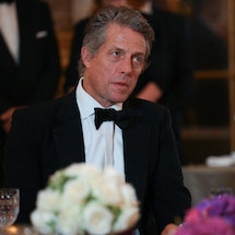 British actor Hugh Grant looks on during a state banquet at the Palace of Versailles, west of Paris,...
